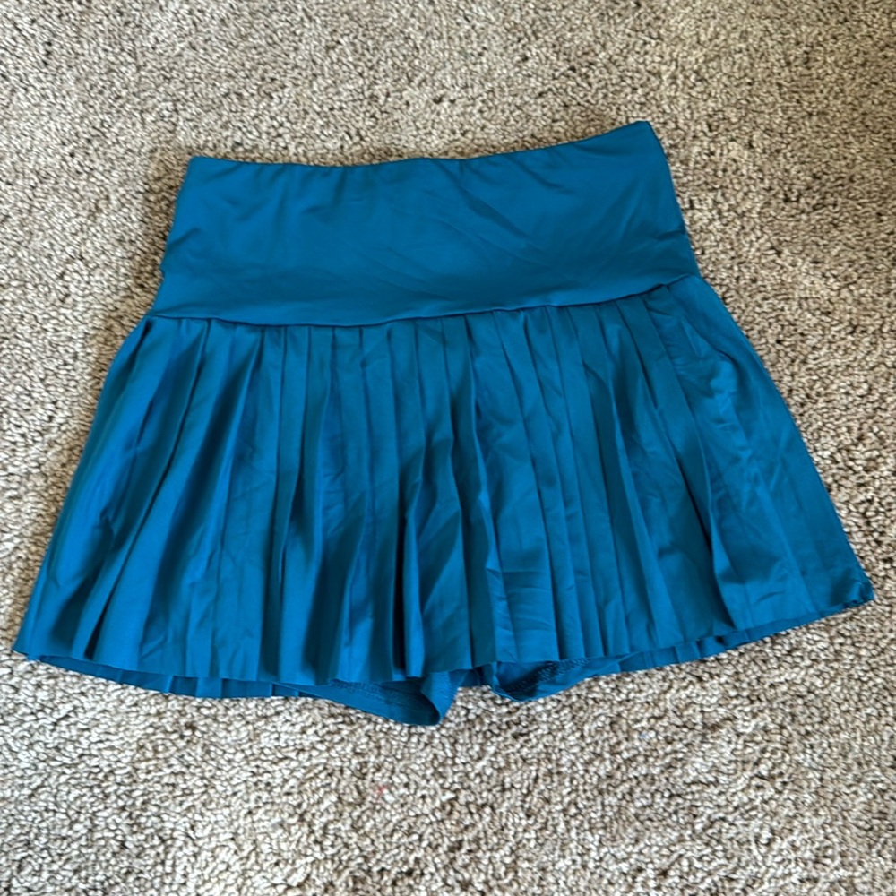 Never worn tennis skirt with built in shorts. Size small fits like XS